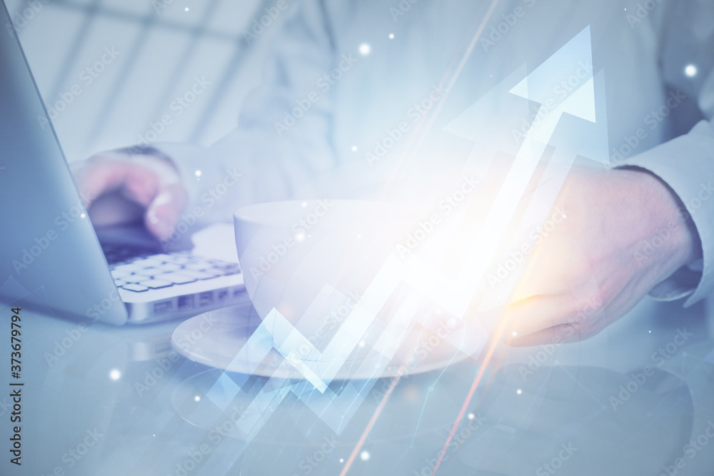 Growing arrows with businessman working on computer on background. Success concept. Double exposure. Growing arrows with businessman working on computer on background. Success concept. Double exposure.