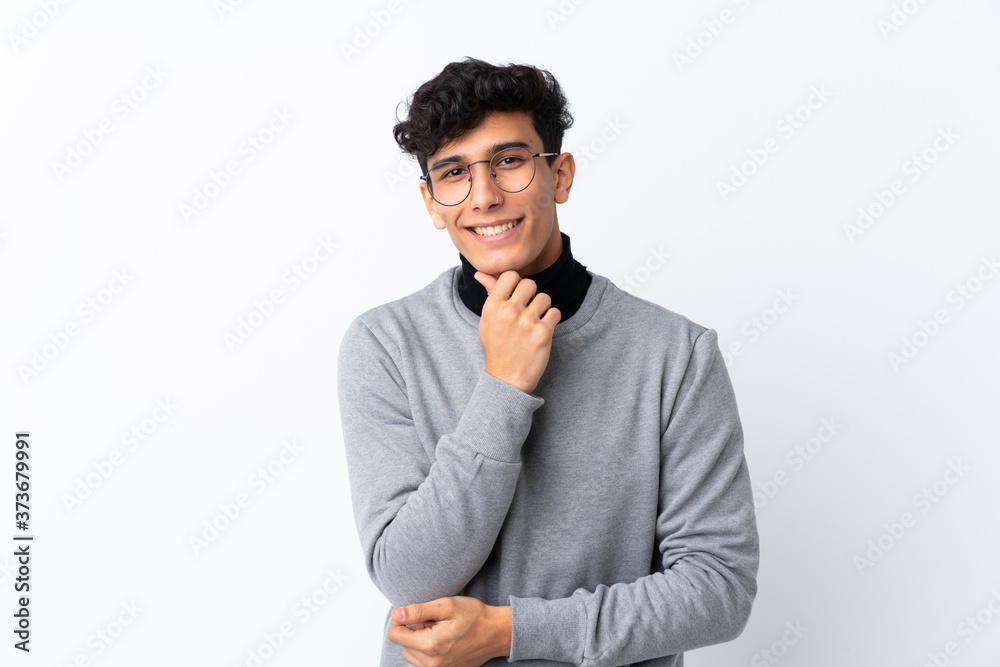 Young Argentinian man over isolated white background with glasses and smiling Young Argentinian man over isolated white background with glasses and smiling