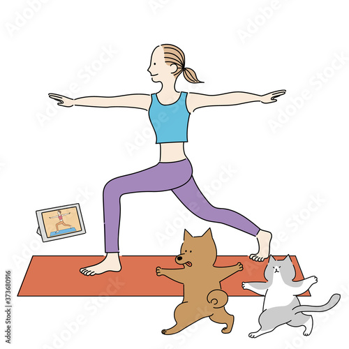 オンラインでヨガのレッスンを受ける女性と犬猫