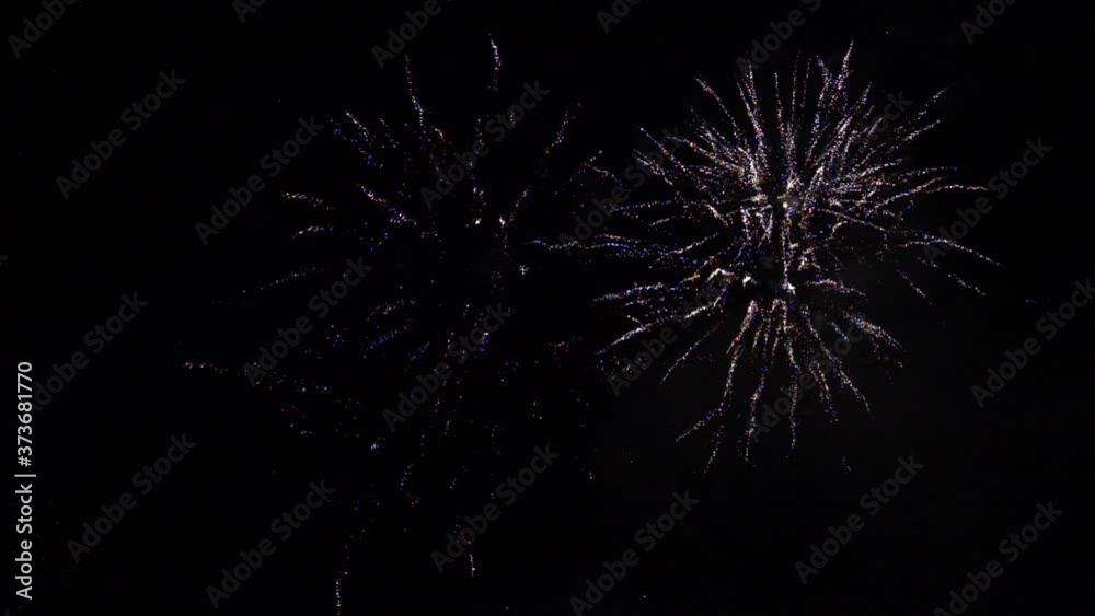 Beautiful real fireworks show in night sky. New Year firework. Celebration Beautiful real fireworks show in night sky. New Year firework. Celebration