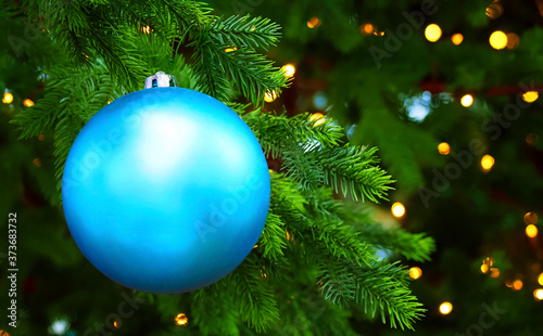 Christmas panoramic background, blue christmas tree ball toy on christmas tree, space for text. Gifts and congratulations holidays concept, xmas