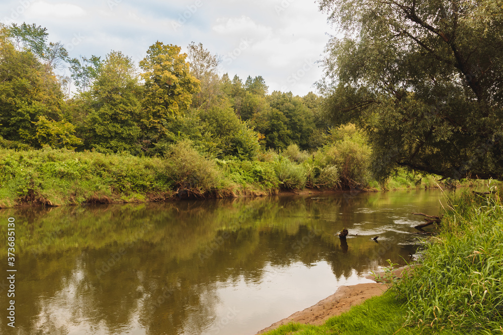 Summer river among green trees, russian nature Summer river among green trees, russian nature