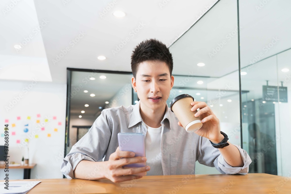 Young smart asian business man in casual shirt at the office, Young smart asian business man in casual shirt at the office,