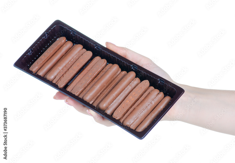 Chocolate sticks sweet in hand on white background isolation Chocolate sticks sweet in hand on white background isolation
