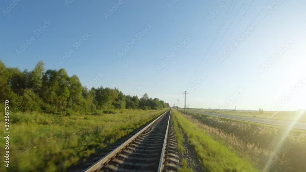 FPV drone flight fast and maneuverable along railway in a clear sunny day FPV drone flight fast and maneuverable along railway in a clear sunny day