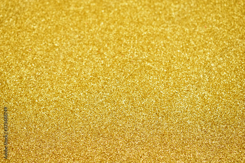 Golden glitter texture background stock images. Golden glittering abstract background stock images. Shiny festive background with copy space for text. Gold shimmer backdrop