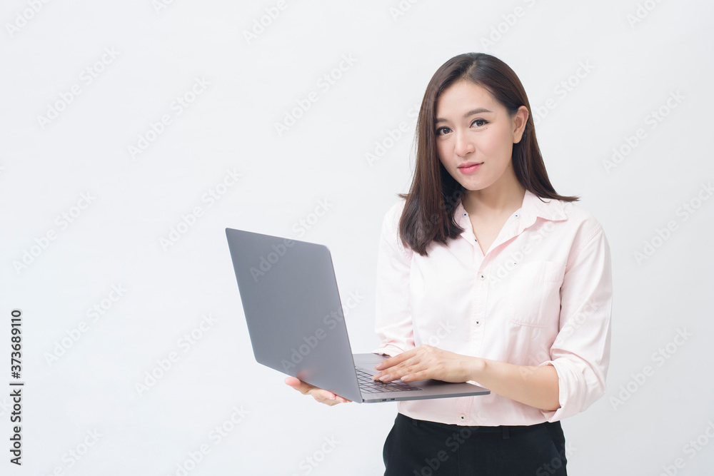 An asian woman is holding laptop computer on white Studio background An asian woman is holding laptop computer on white Studio background
