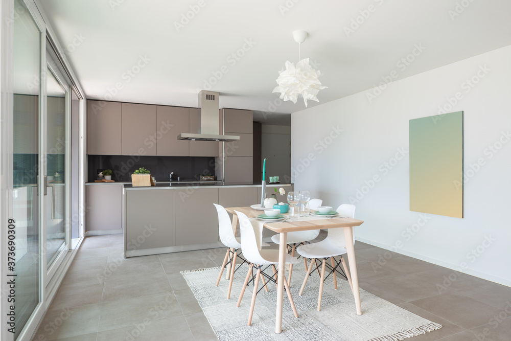 Fototapeta premium Designer set table. Behind the modern designer kitchen with island
