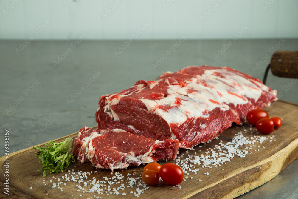 raw beef steak with spices