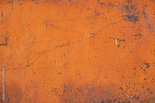 Orange painted aged wall texture, colorful bright grunge background