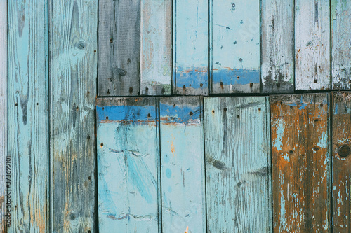 Old blue wooden tiles, vintage boards. Rough aged wood panels, texture background. 