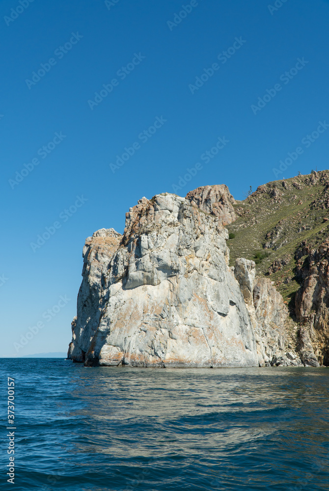 Cape Sagan-Khushun, rocky coast. called as the Cape Three brothers. Three stone peaks symbolizing the three brothers.