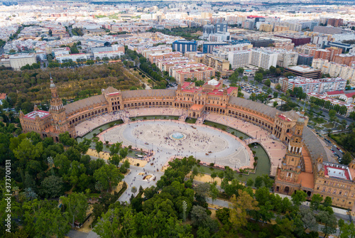 Aerial view of Plaza d'Espana with park and a bridge on ver the canal in Sevilla