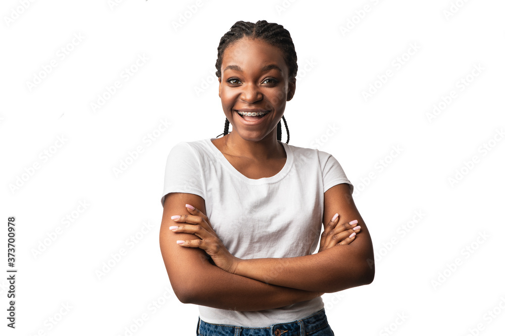 African Girl With Braces Posing Crossing Hands Over White Background African Girl With Braces Posing Crossing Hands Over White Background
