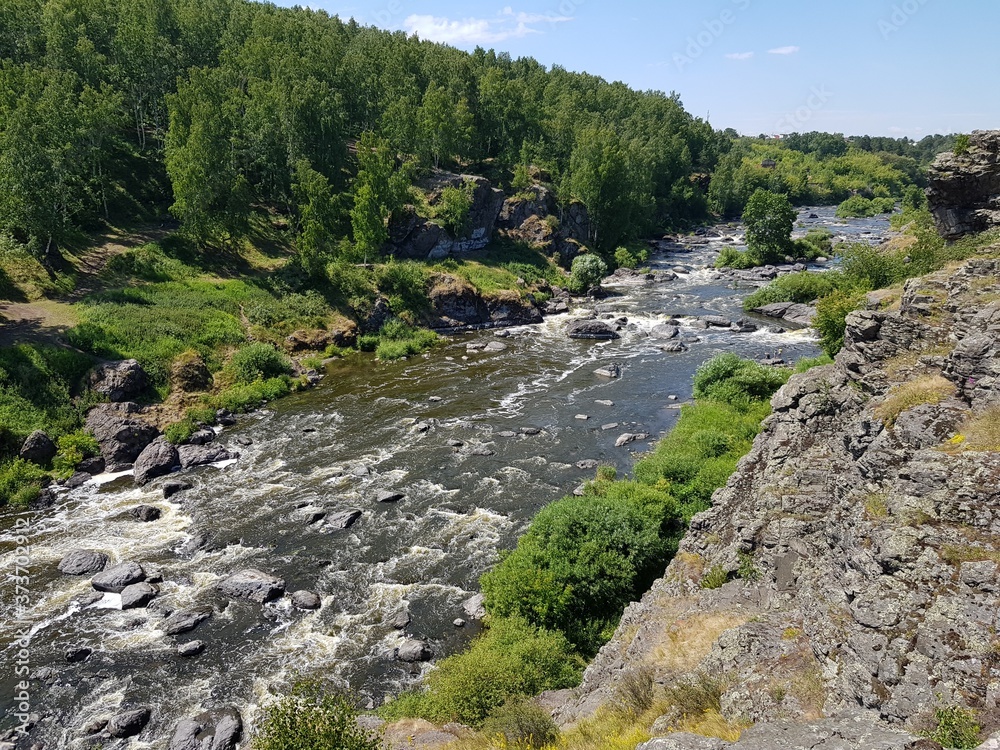 Large boulders in a mountain river Large boulders in a mountain river