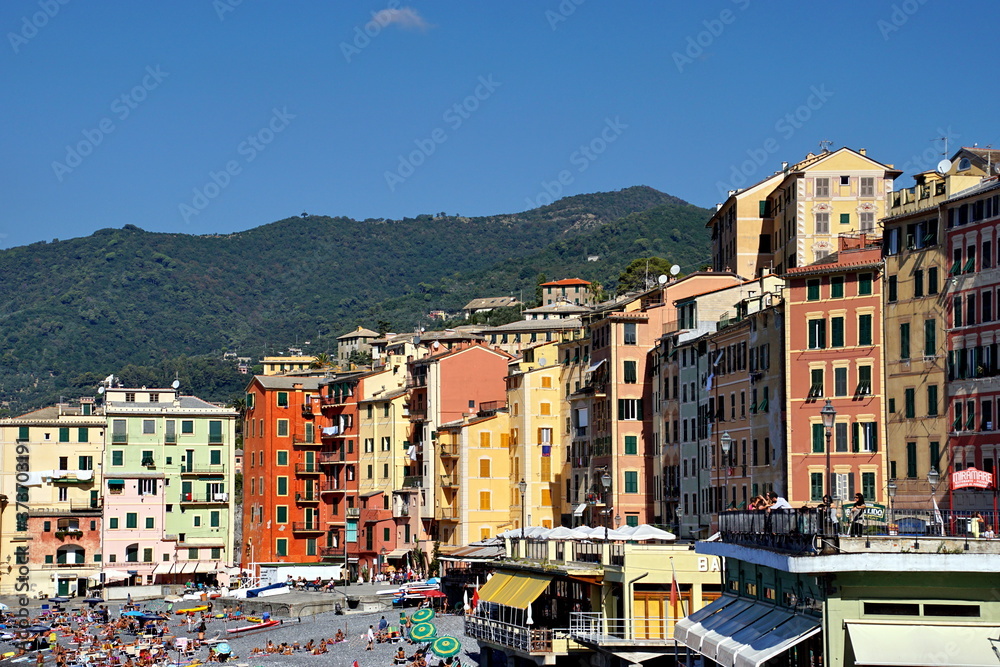Colorful buildings and beach at Camogli on sunny summer day, Liguria, Italy