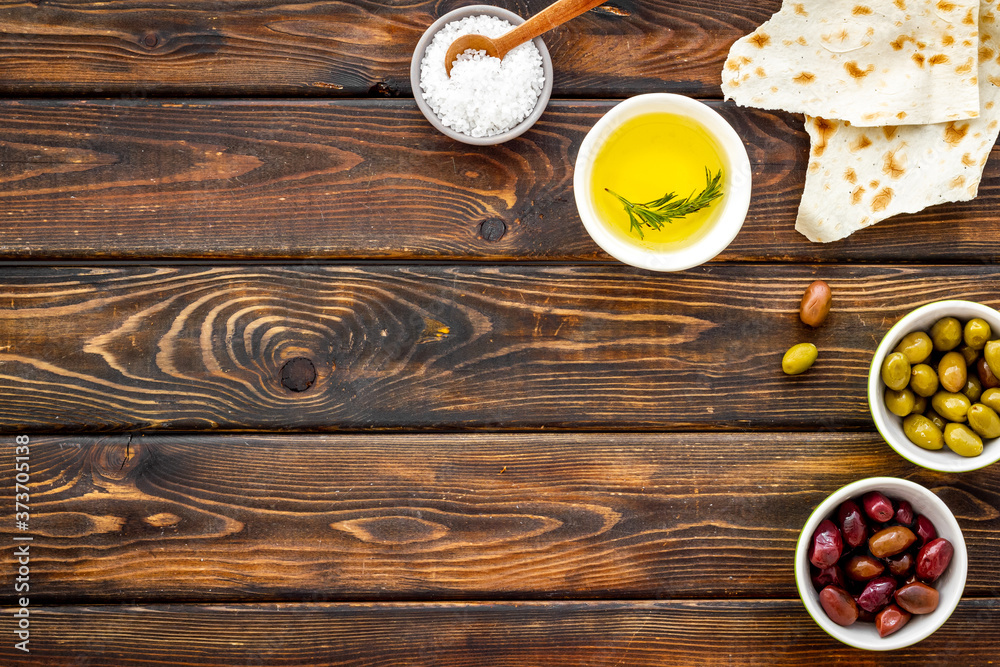 Italian olives, oil, bread - appetizer and snacks - top view copy space Italian olives, oil, bread - appetizer and snacks - top view copy space