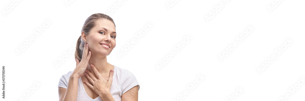 Pretty caucasian girl. Home skincare routine. Self massage. Cosmetology concept. Antiage healthy procedure. Hands near neck. White background. Perfect face. Smiling portrait. Copyspace. Natural makeup Pretty caucasian girl. Home skincare routine. Self massage. Cosmetology concept. Antiage healthy procedure. Hands near neck. White background. Perfect face. Smiling portrait. Copyspace. Natural makeup