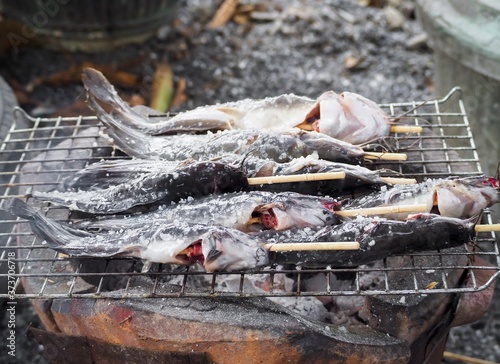  fish on the grill with salt, street food 