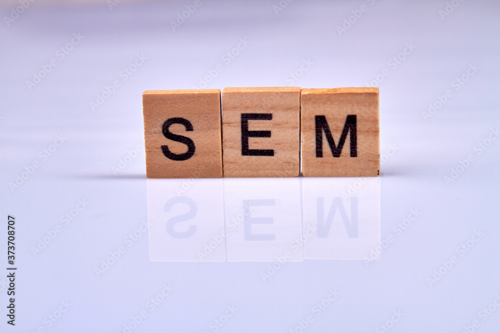 Search engine marketing. Wooden cubes with sem abbreviation isolated on white background. Web optimization concept. Search engine marketing. Wooden cubes with sem abbreviation isolated on white background. Web optimization concept.