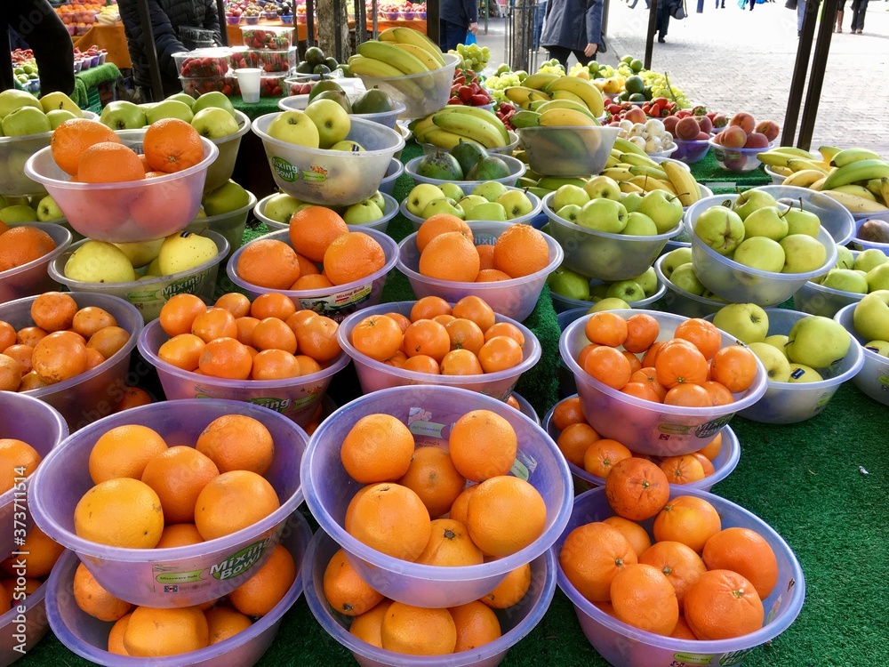 Oranges and apples on display at a farmers market - UK