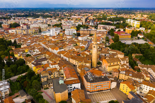 Scenic cityscape from drone of Italian town of Pordenone in sunny day, Italy