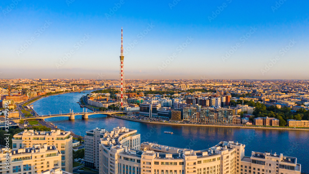 Russia. Panorama of Saint Petersburg in the white nights. View of the night city from a height. Houses and the Neva river. Rivers Of St. Petersburg. New quarters of St. Petersburg. Trip to Russia.