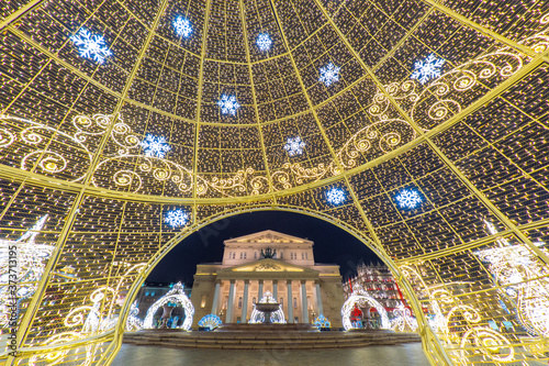 Moscow. Russia. The Bolshoi theater is framed by luminous garlands. Sights of Moscow in new year's decoration. Christmas decorations of the capital. Glowing decorations in evening Moscow. photo