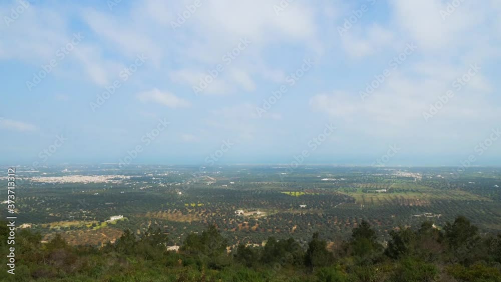 Wide view of millennial olive trees valley, Unesco site. Thousands of olive trees and running clouds. Landscape from Ostuni, Apulia. Italy Wide view of millennial olive trees valley, Unesco site. Thousands of olive trees and running clouds. Landscape from Ostuni, Apulia. Italy