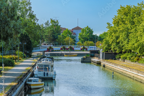 Motor boats moored along embankment of Kyrksundet (fin. Kirkkosalmi; en. Church Strait) in Pargas (Parainen in Finnish), Turku archipelago, Finland.