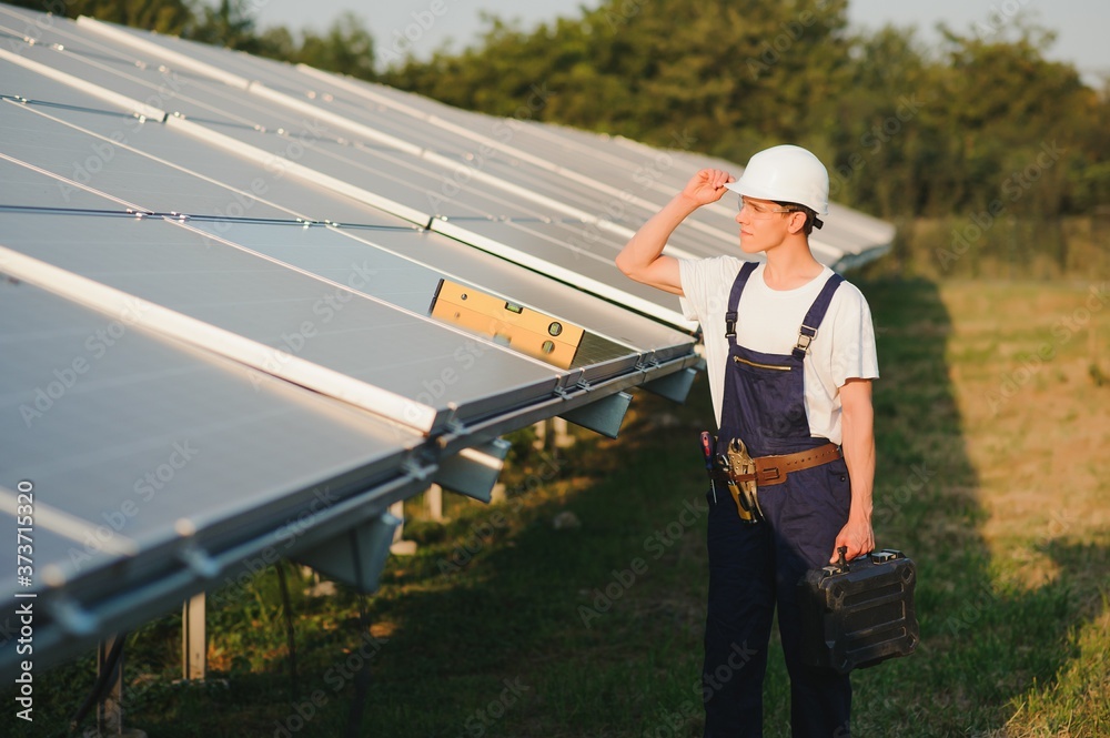 Renewable energy and solar power concept, worker or Electrical engineers are checking and training installing photovoltaic plant in solar power station alternative energy from nature