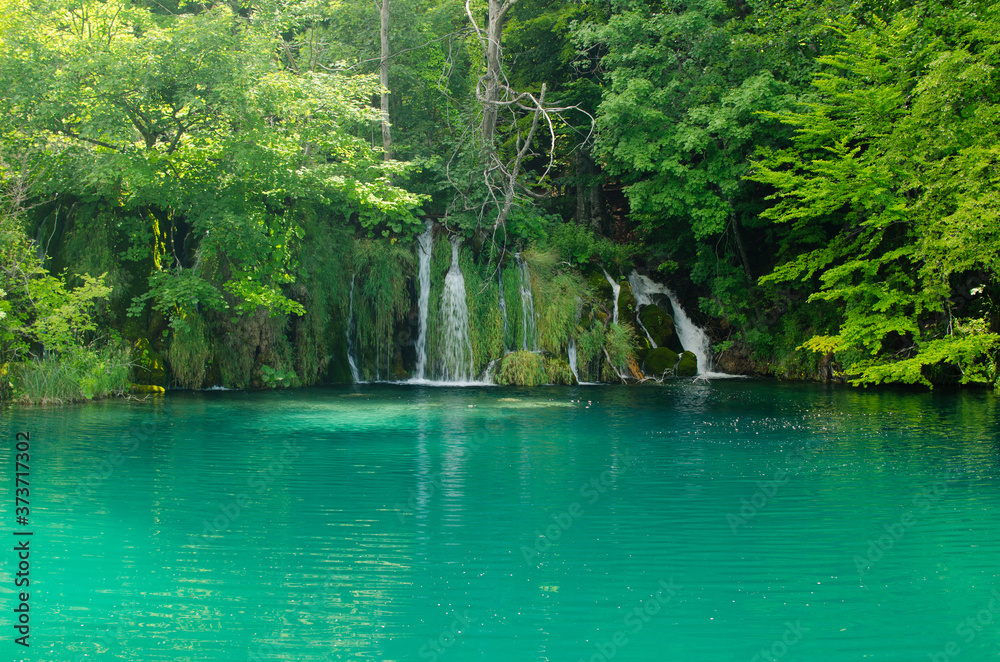 Fototapeta premium Waterfalls and turquoise lake