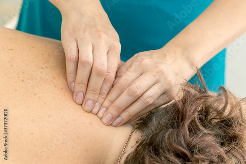 Back massage with hands in the SPA. Close up