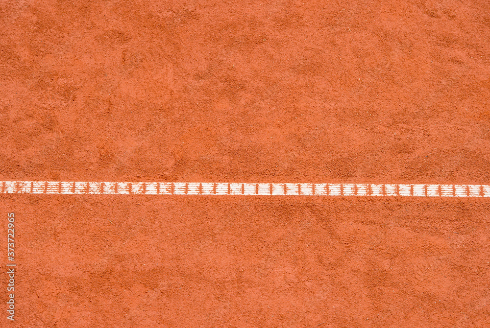 Fototapeta premium Orange tennis court white lines background. Sport, recreation and training concept. Background for tennis, rugby, cricket, baseball and paddle school banner...