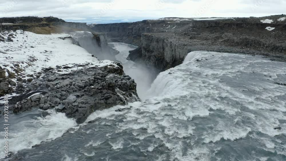 Drone aerial view of Dettifoss Waterfall, Iceland - downstream reveal shot Drone aerial view of Dettifoss Waterfall, Iceland - downstream reveal shot