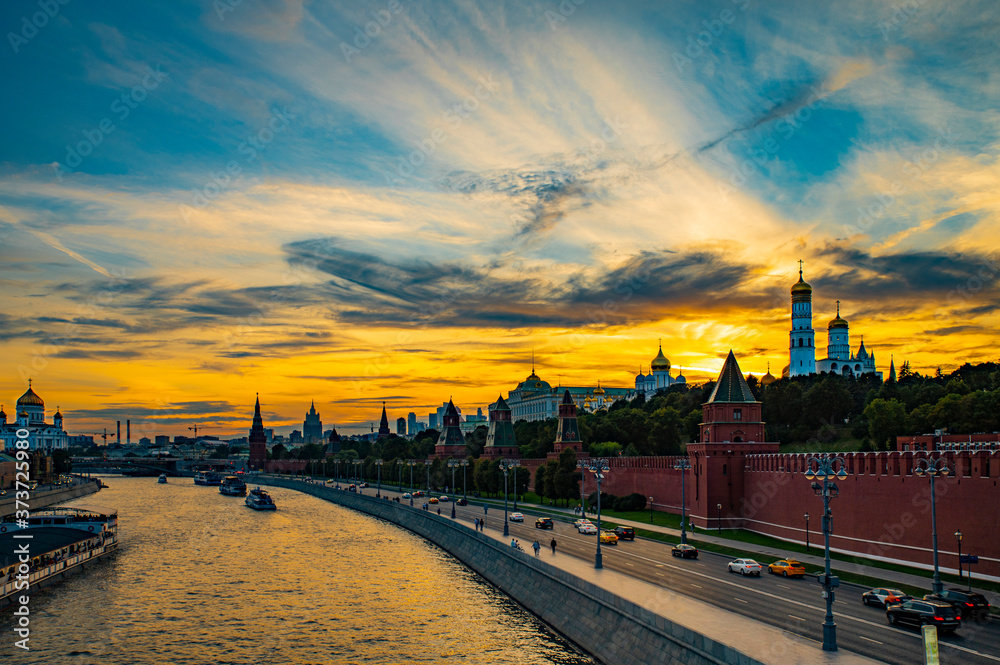 Very colorful fantastically beautiful sunset over the Moscow River and the Moscow Kremlin.