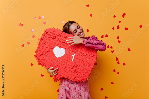 Fotografija Pretty caucasian girl enjoying positive feedback