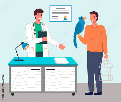 Veterinary care. Veterinarian doctor talking to man with parrot in medical office. Person brought a bird in a cage for treatment to a medic. Visit to the vet clinic to check the health of the animal