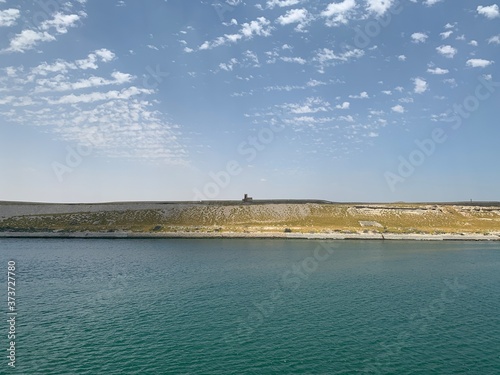 A small check-post under blue sky in Suez Canal. © Kamal