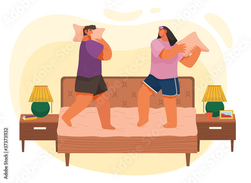Young couple having pillow battle, man and woman wearing pajamas enjoying time together lovers beat with pillows standing on bed at home modern apartment bedroom interior horizontal flat illustration