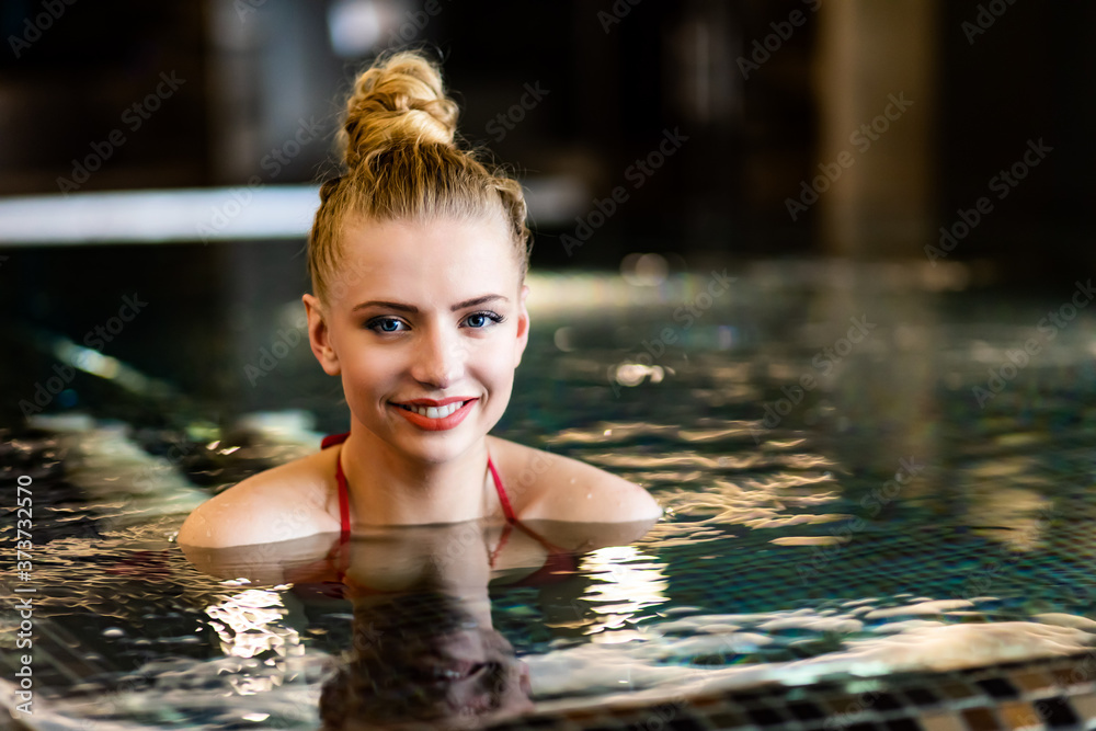 Woman relaxing in a whirlpool bath tube
