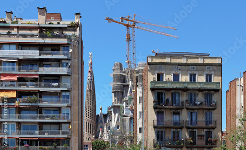 Sagrada familia, Barcelona; ongoing construction work on the central dome, seen from avenida diagonal.   photo