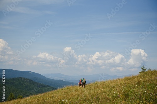 Group of hikers walking on mountain © Serhii