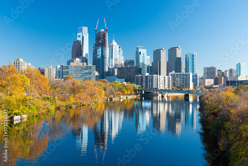 Philadelphia, Pennsylvania, USA downtown skyline on the river in autumn.