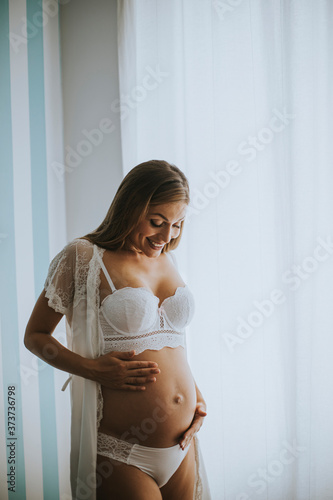 Pretty young pregnant woman...