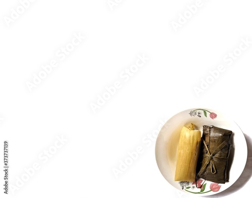 Authentic Tamale with corn and banana leaf on white background, typical food of Guatemala