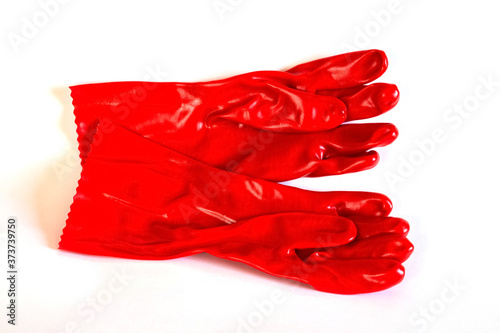 Red rubber protective gloves on a white isolated background