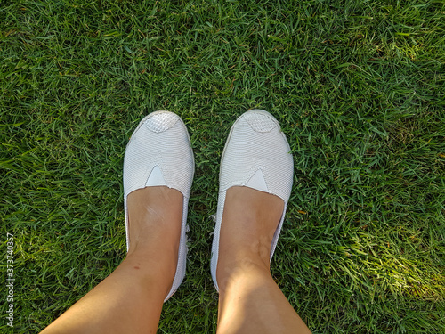 shoes on the green grass outdoor background