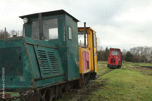 Old diesel locomotives on a railroad siding in a moor