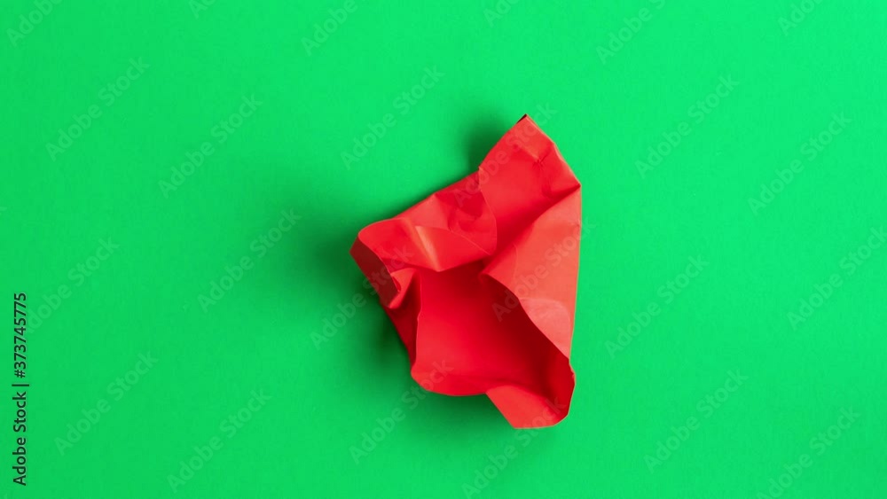 Red Paper Heart Beat shave transformation on green background. 4K Stop Motion Animation.